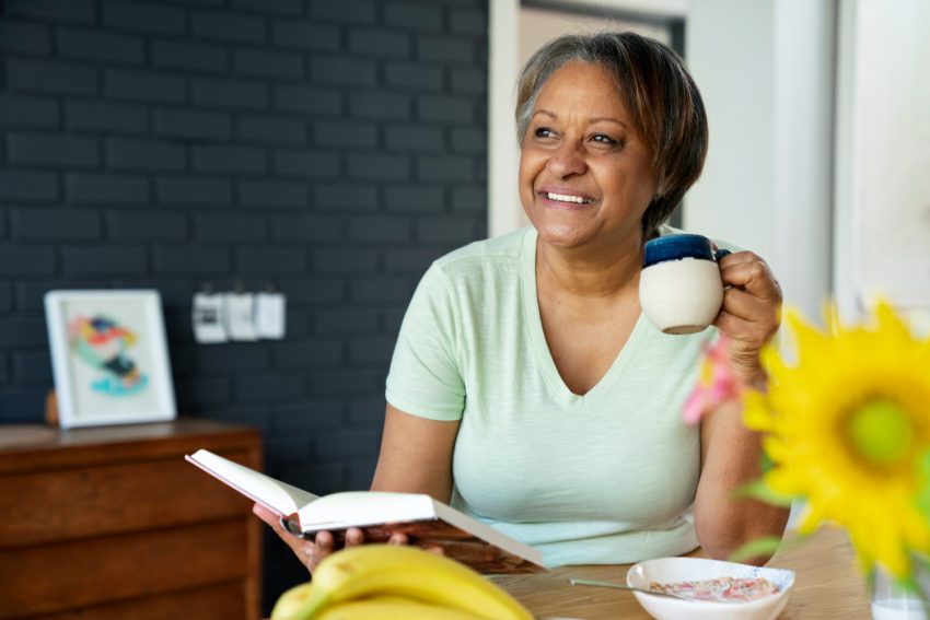 front-view-smiley-woman-with-book